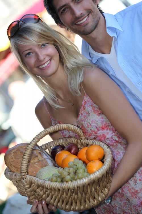 Couple buying fruits