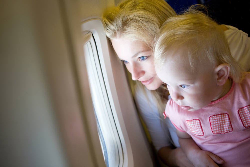 Mother and child looking out of an airplane window