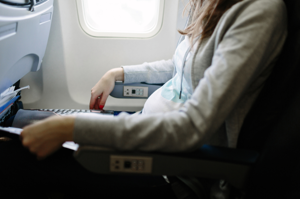 Pregnant woman in an airplane